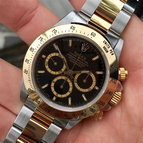 rolex daytona gold black face